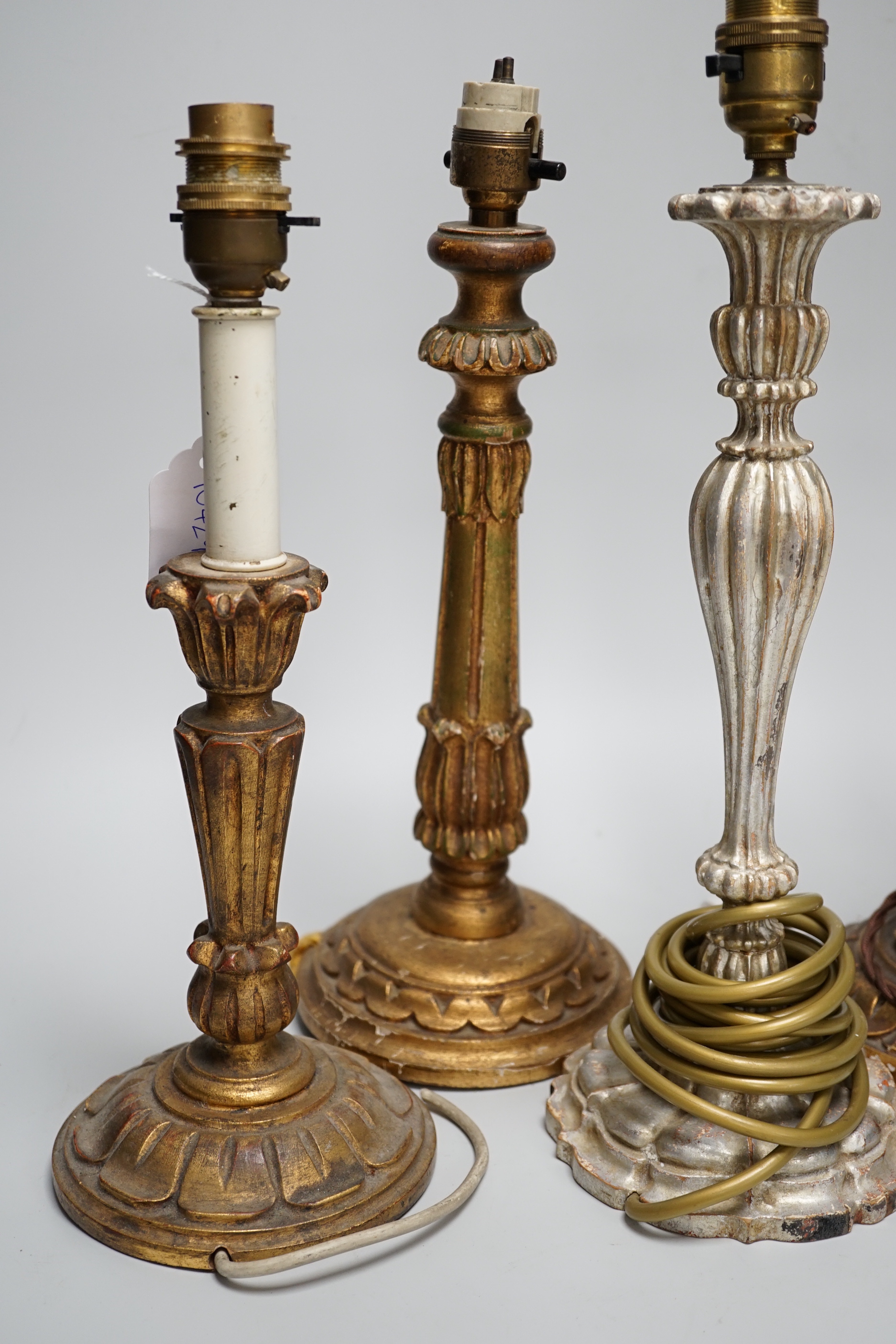 Four antique-style gilt and silvered wood table lamps, the largest 43cm high including the fitting